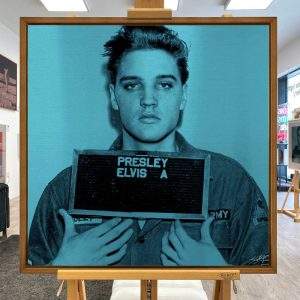 Elvis Presley (most Wanted) aluminium artwork by Louis Sidoli in blue aqua presented in a walnut frame.