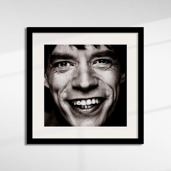 Mick Jagger - Diamond Tooth in a black frame.